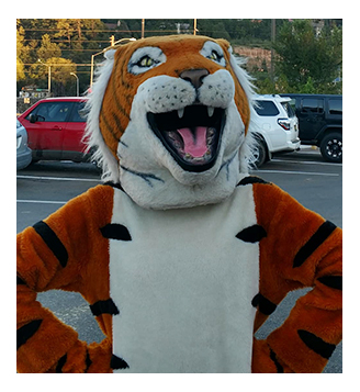Capitan High School fighting tiger mascot outside posing for a picture 